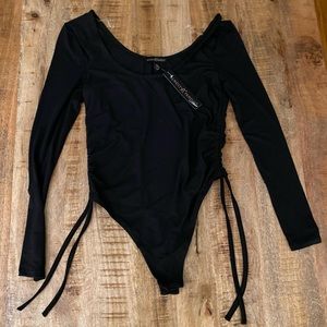 Almost famous black bodysuit high leg with drawstrings ruching on sides NWOT